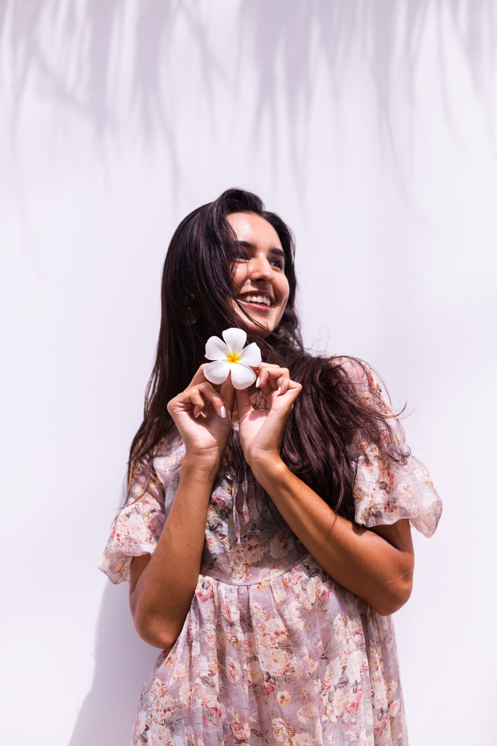 Happy Smiling Long Haired Woman Dress Stands White Wall Scaled